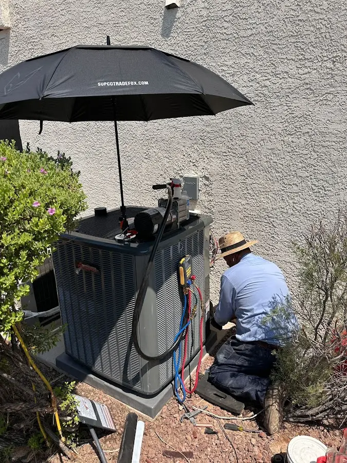 HVAC technician performing outdoor AC maintenance in Rye